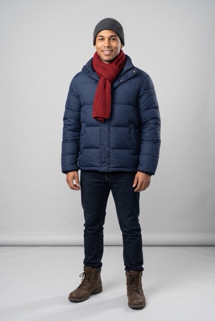 AI-made photo: a man in a navy puffer jacket, red scarf and grey beanie